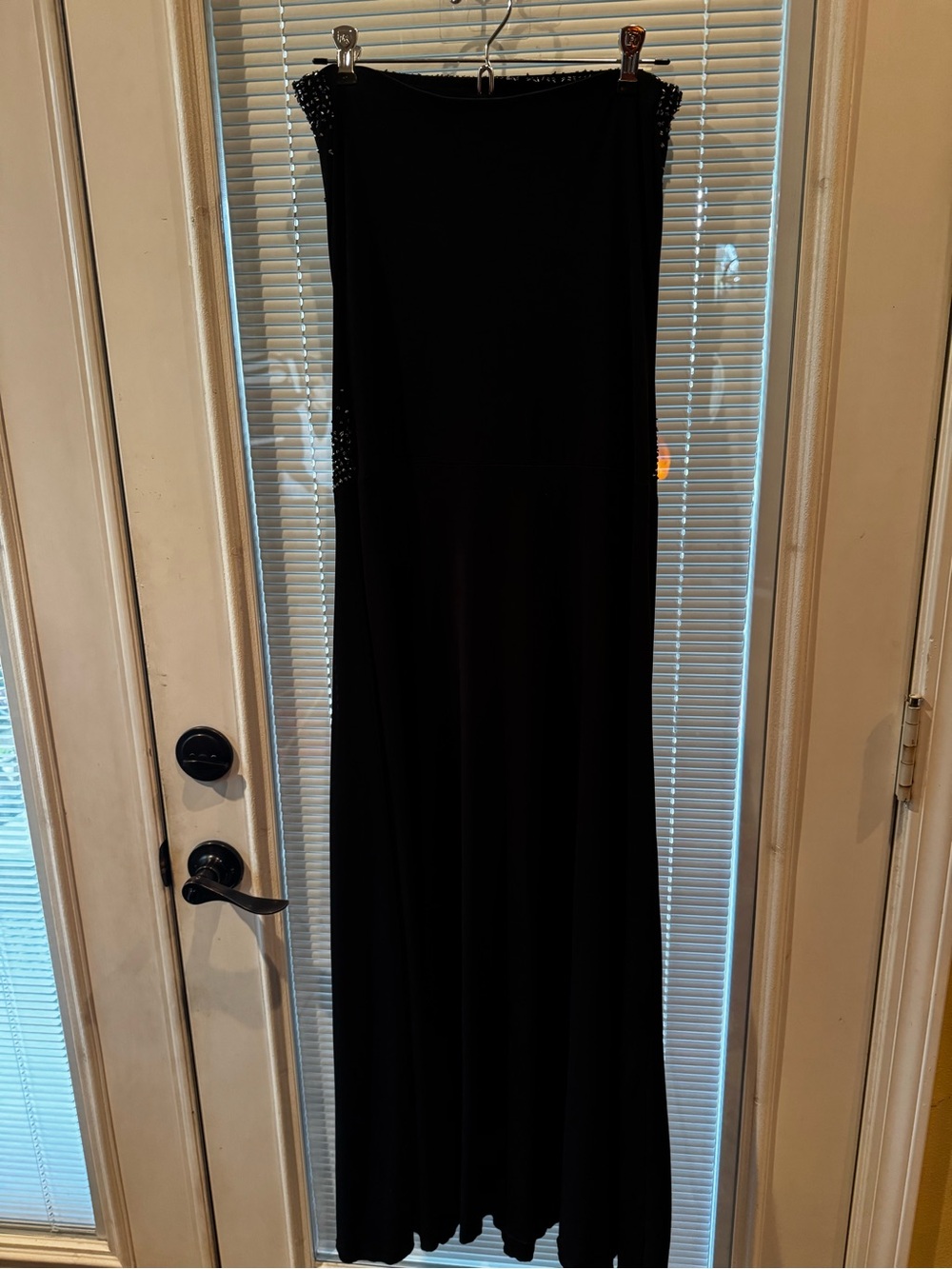 Lipstick strapless black evening gown. Diamond design crystals on front.